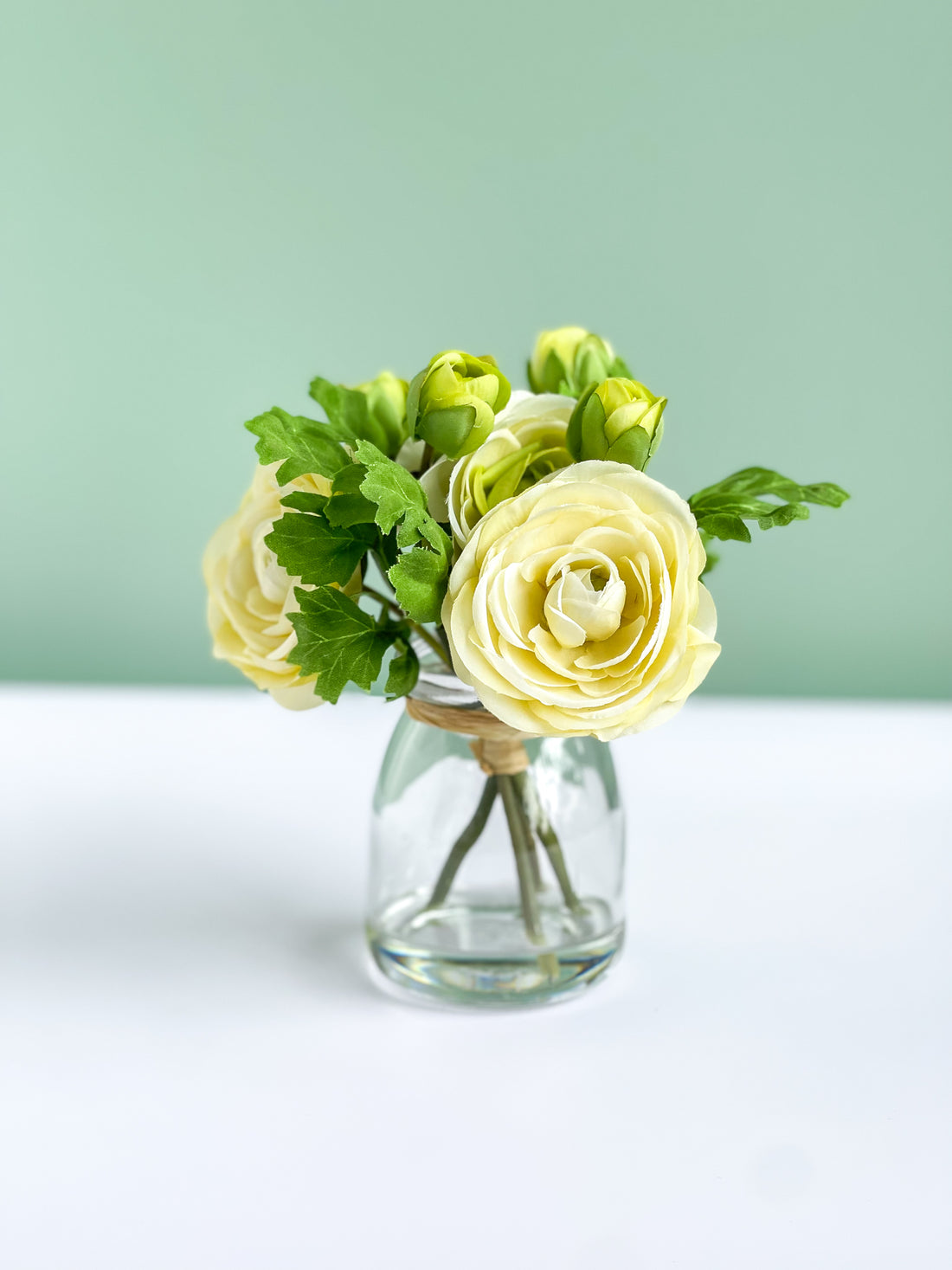 White Ranunculus Roses In Glass Vase with Faux Water