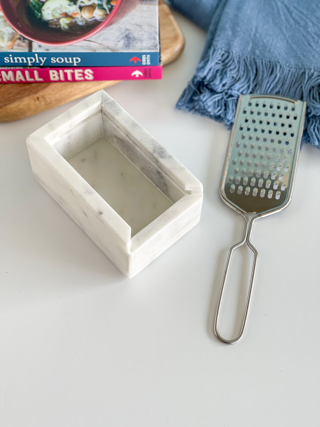 https://southernlyplace.com/cdn/shop/products/marble-stainless-steel-cheese-grater_1100x.jpg?v=1655475802